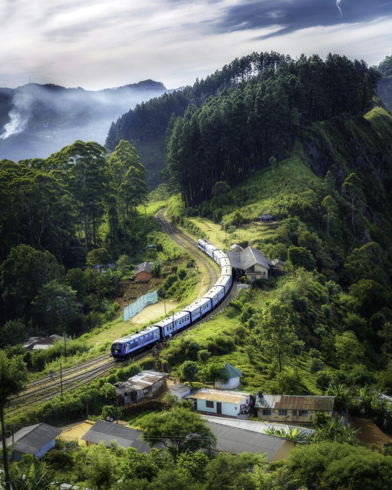 Photo Of Railway On Mountain Near Houses